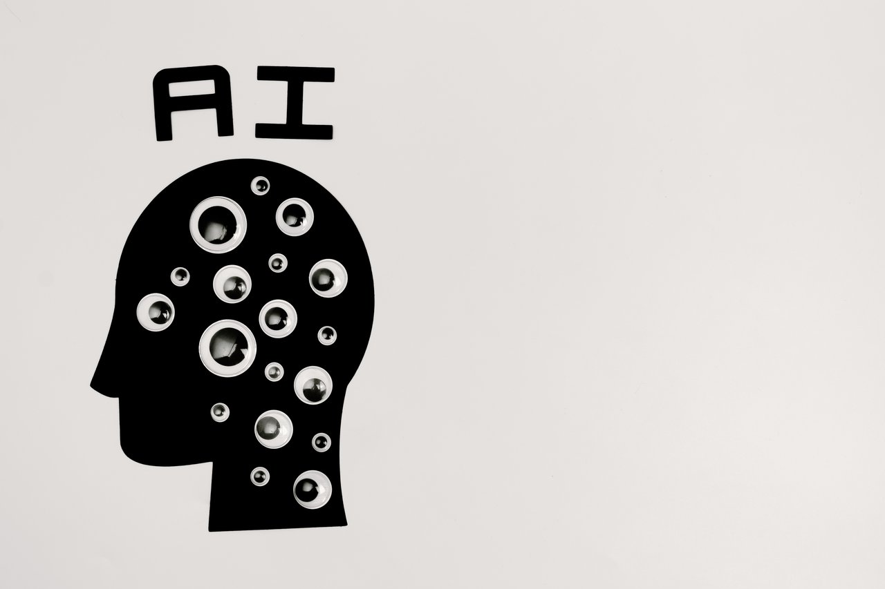 services-03 Abstract illustration of AI with silhouette head full of eyes, symbolizing observation and technology.